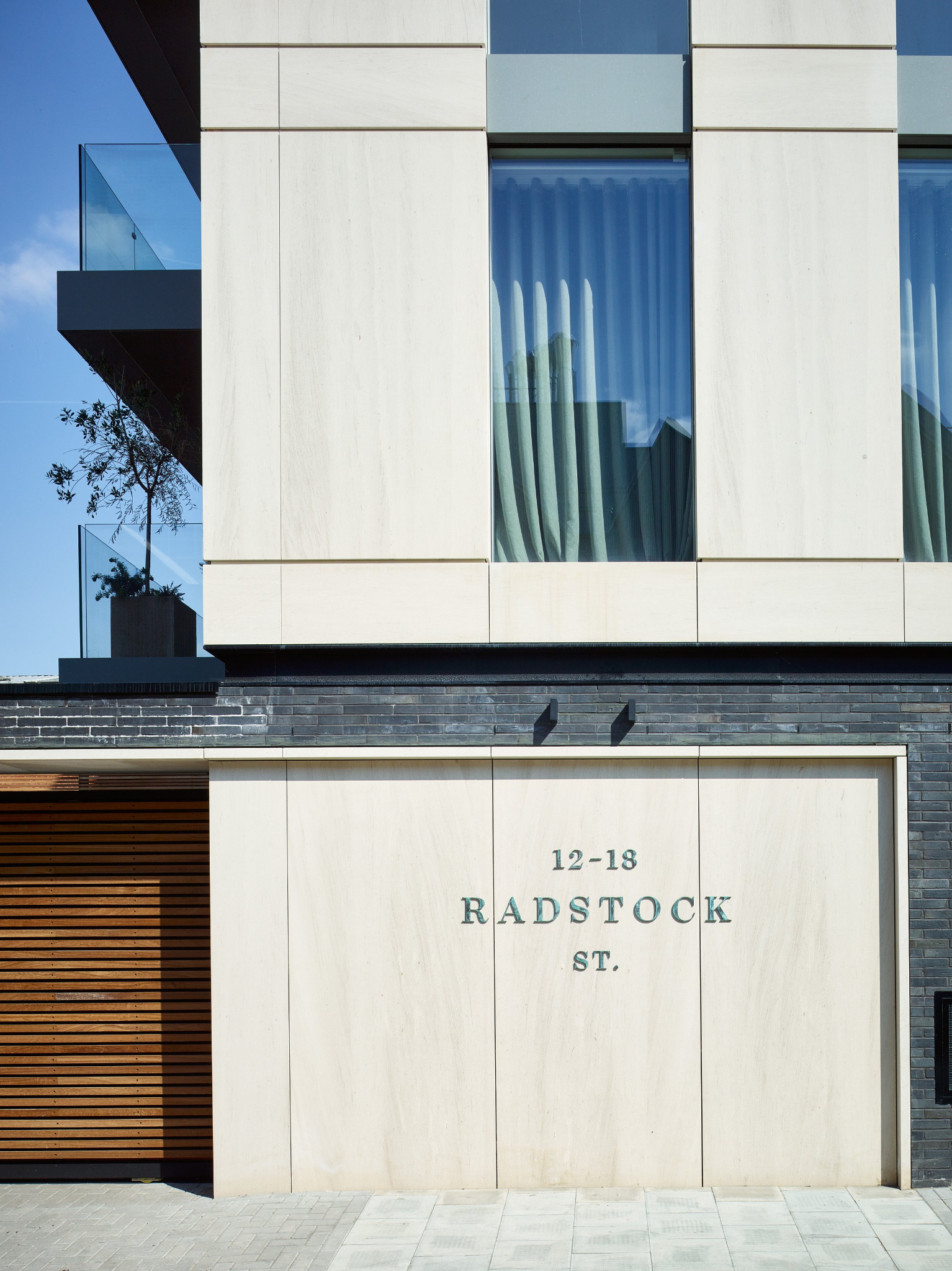 CAL_arch architectural project facade with balcony, glazing and pale brickwork